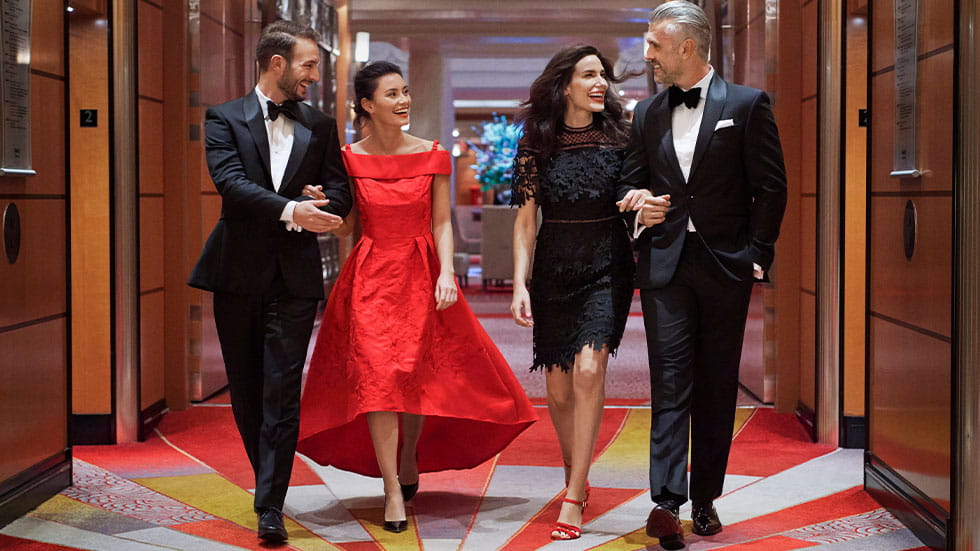 Two couples wearing formal wear to a gala on Cunard cruise ships