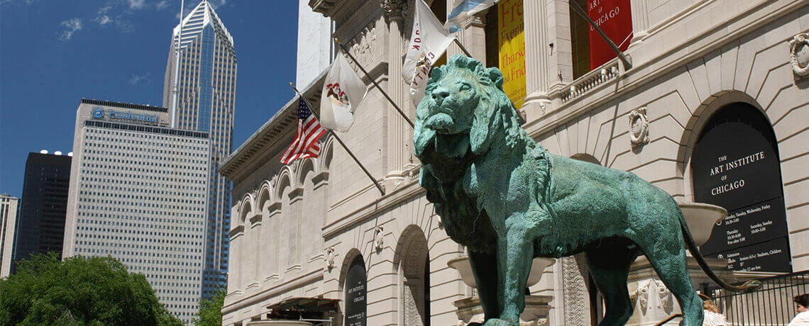 Two bronze lion statues stand guard and welcome visitors to the the Art Institute of Chicago, the second largest art museum in the United States. 