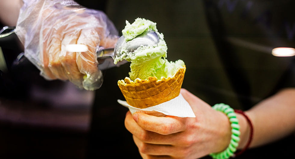Scooping Ice cream into Ice cream cone