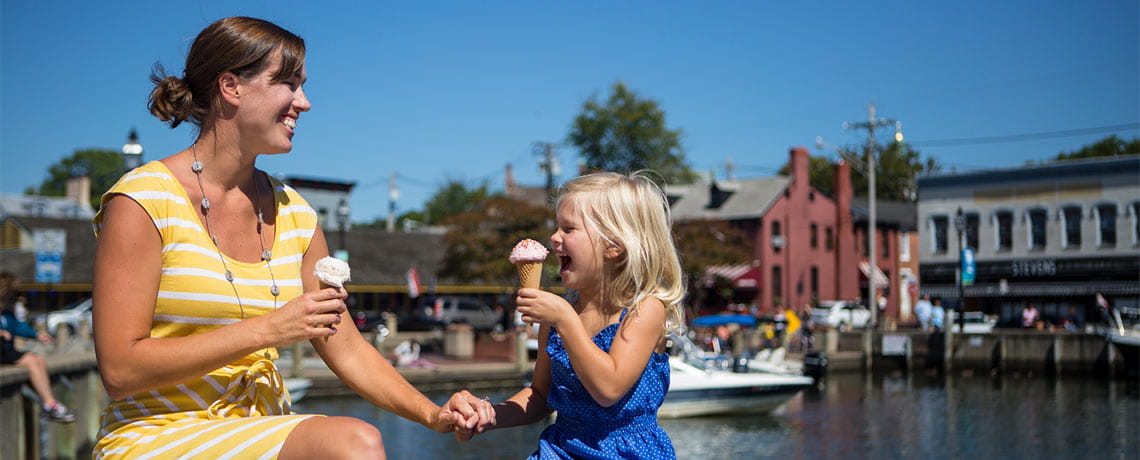Woman and child enjoying ice cream at City Dock in Annapolis, Maryland