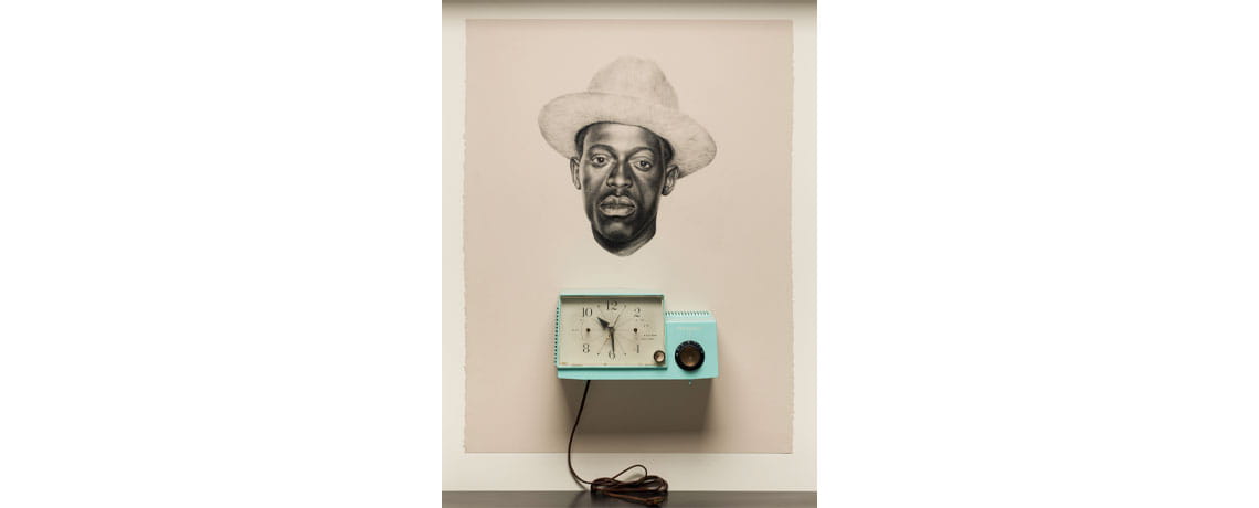 Whitfield Lovell, Kin XXXV (Glory in the Flower), 2011; Conté on paper, vintage clock radio, 30 x 22 3/4 x 5 3/4 in.; The Phillips Collection