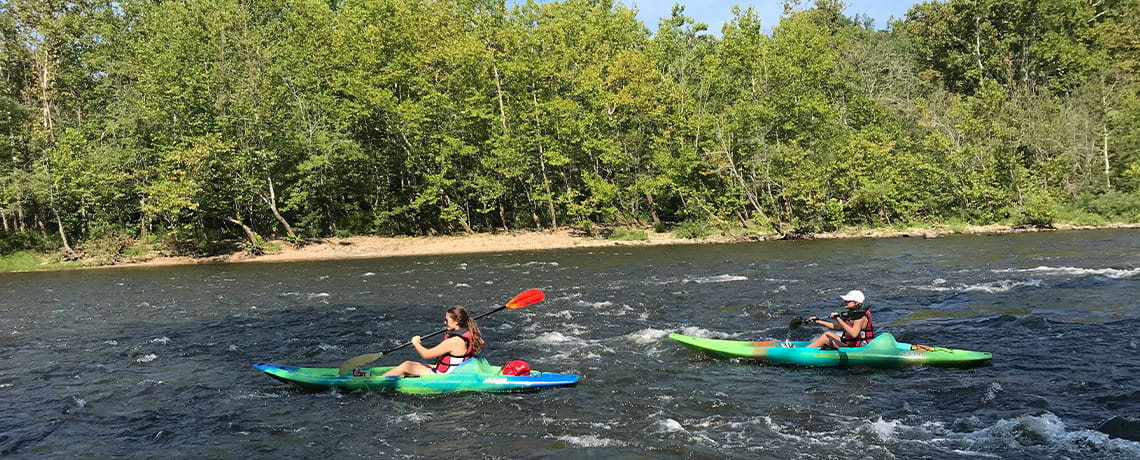 People paddling kayaks in the Upper James River, Virginia