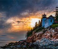Bass Harbor Lighthouse With Storm Clouds at Sunset