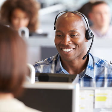 happy man working in a call center
