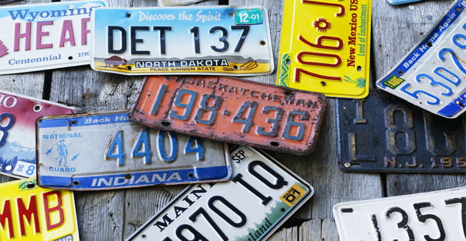 Pile of licenses plates from around the USA