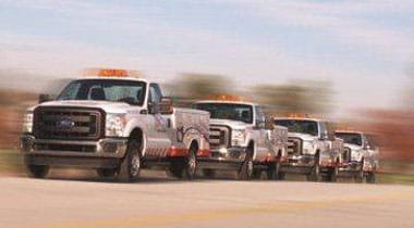 AAA fleet vehicles on a highway