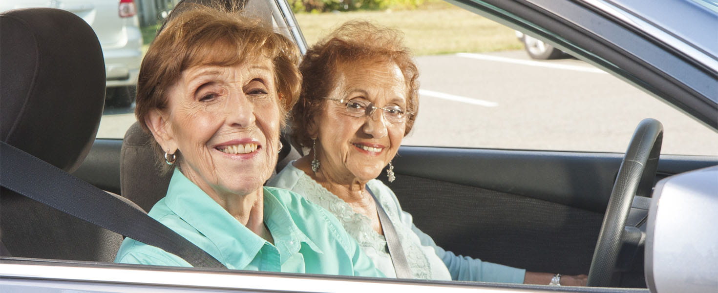 Senior Citizens Friends Drivng in a Car