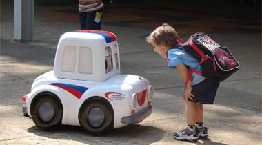 Big Toy Car Otto Auto next to a Kid
