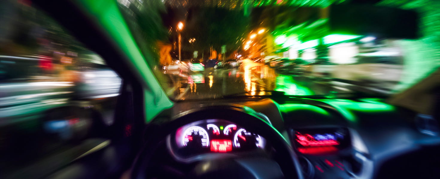 Blurry road and car indicating an impaired driver
