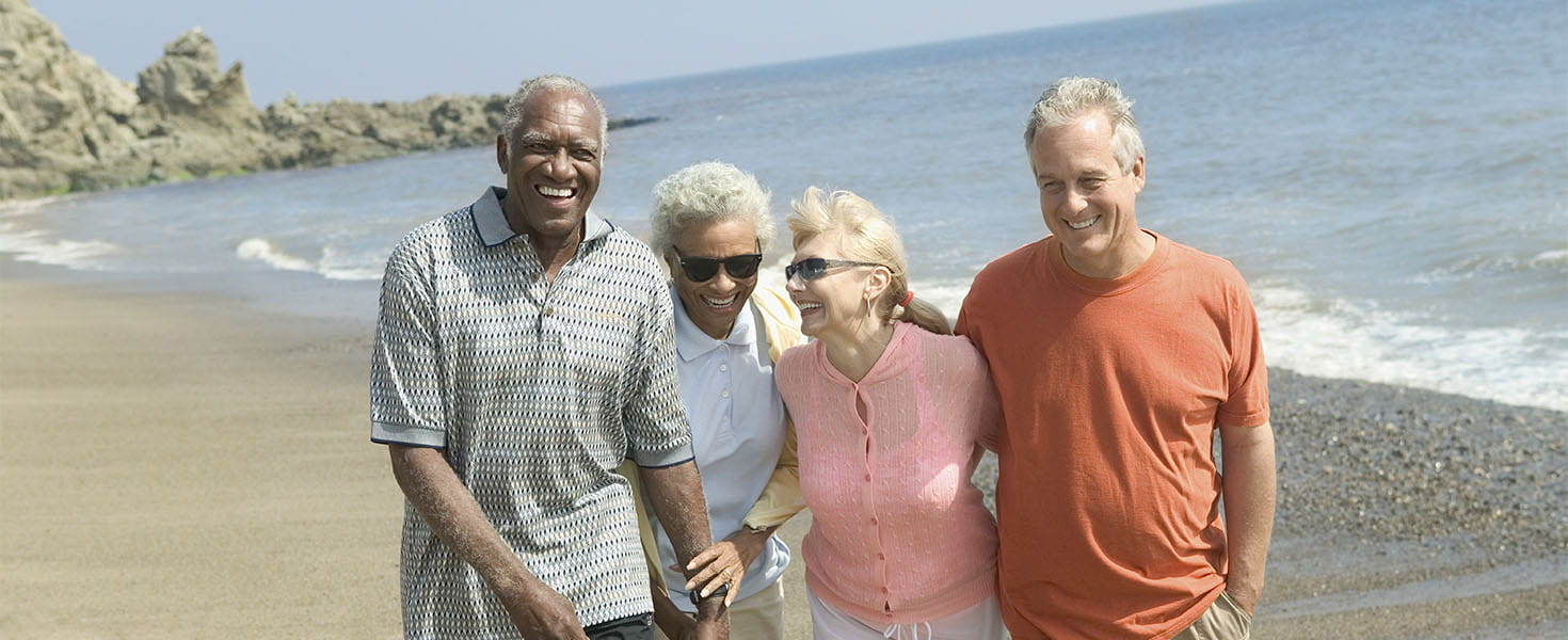 Two Older Couples Walking on Beach