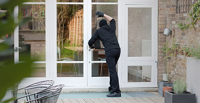 burglar breaking into a house