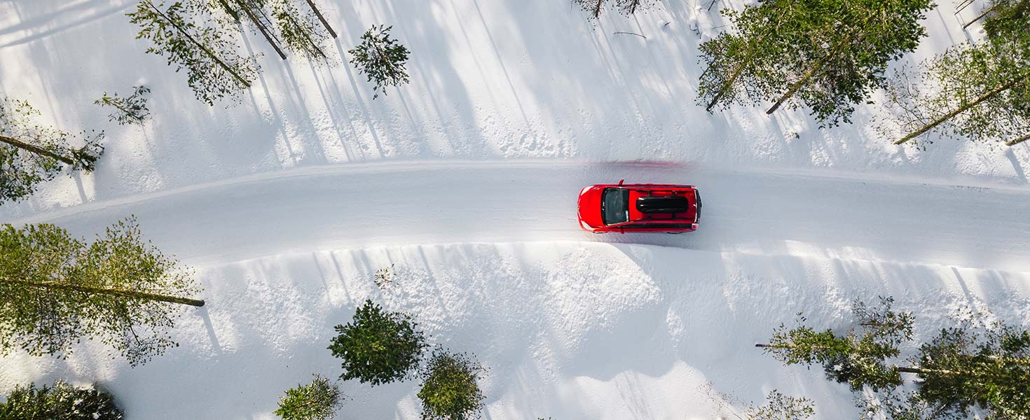 Car driving through snowy road