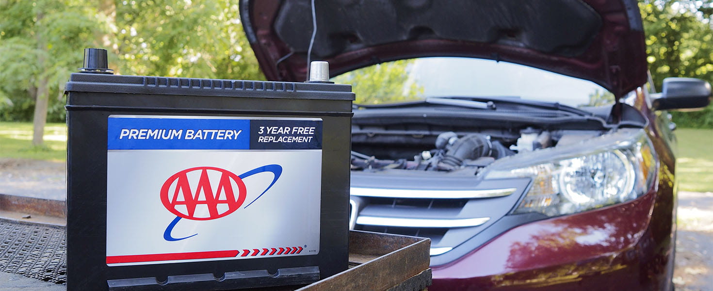 AAA Battery in front of van.