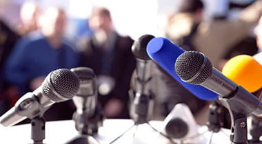 Gathering of media microphones.