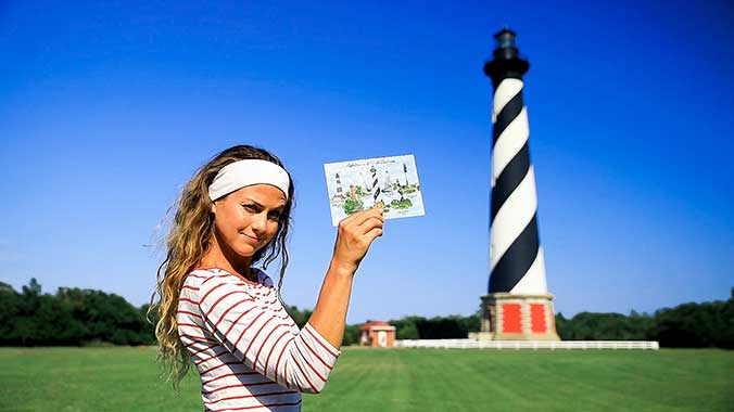 woman standing in front of lighthouse 