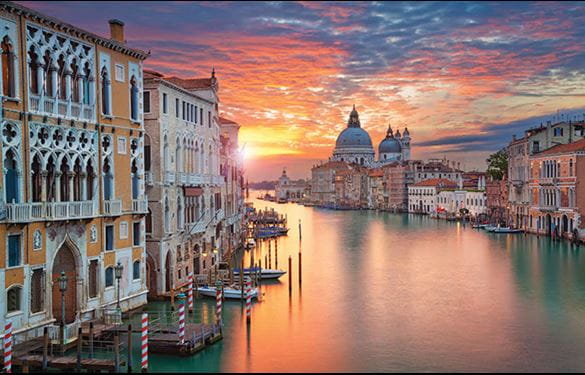 Historic Venice, with picturesque sunset and clouds over the water