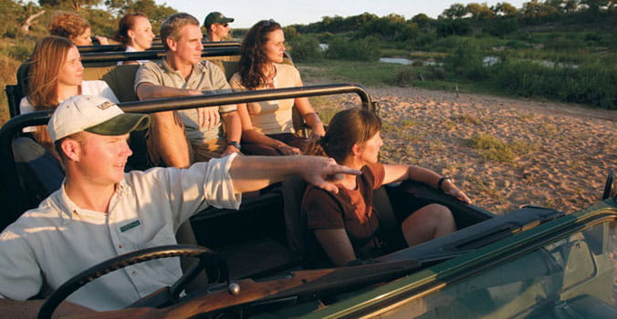 Group of travelers on africa safari tour.