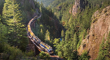 Rocky Mountaineer train winding around a canyon