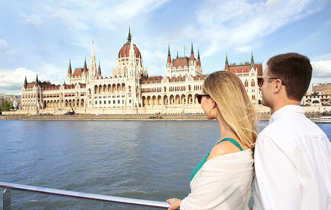Couple on deck AmaWaterways ship sailing into Budapest