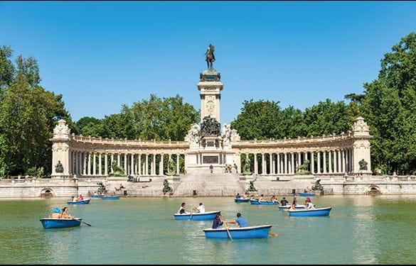 El Retiro Park and Monument to Alfonso XII, visitors canoeing in water