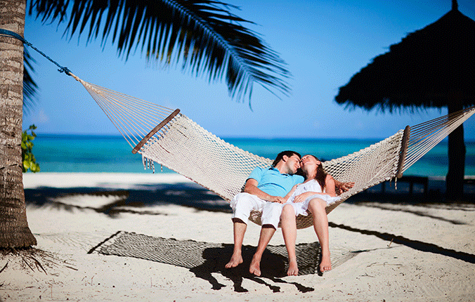 Couple in a hammock on a beach