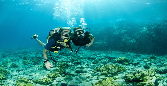 Man and Woman scubadiving in the Caribbean