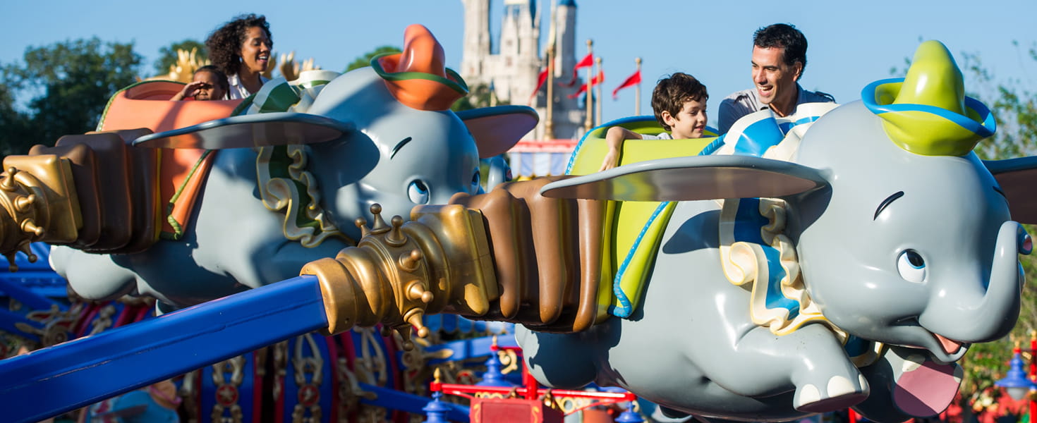 Parents and children on the Dumbo ride in Disney World