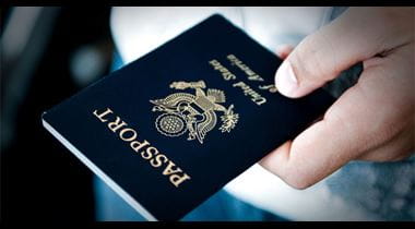 Persons hand holding a passport