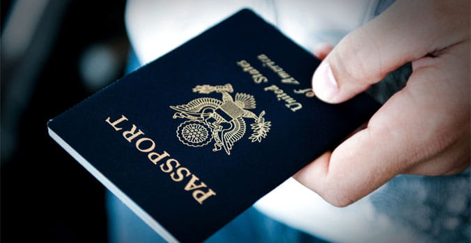 Persons hand holding a passport