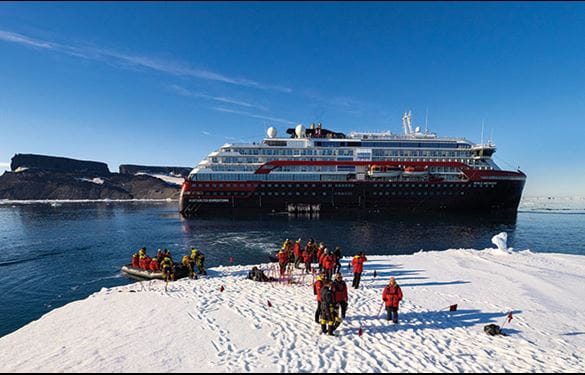 Hurtigruten Expeditions ship and travelers in Antarctica