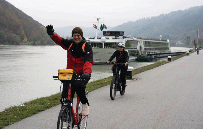 Tauck guests riding bicycles along the Blue Danube