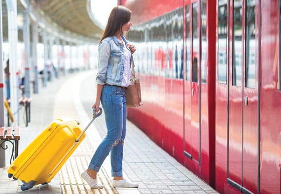 Woman boarding a train in Europe