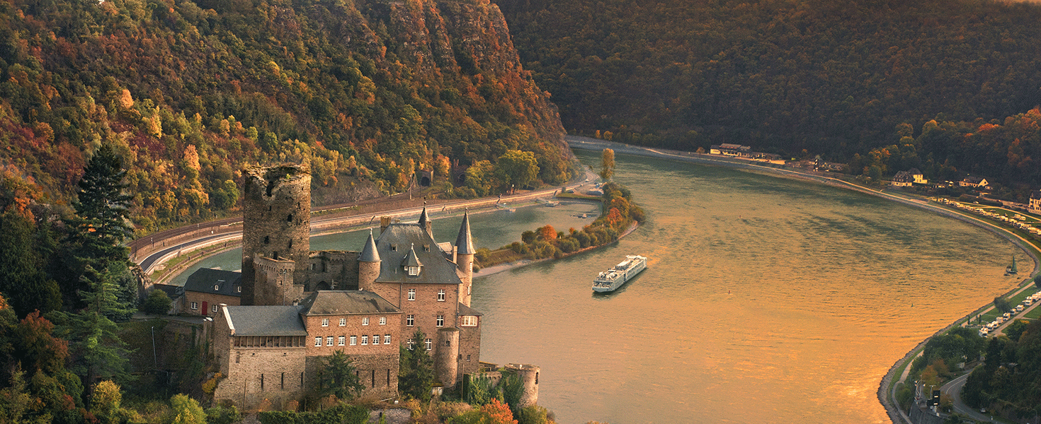 Viking ship sailing along the Rhine and the Katz Castle