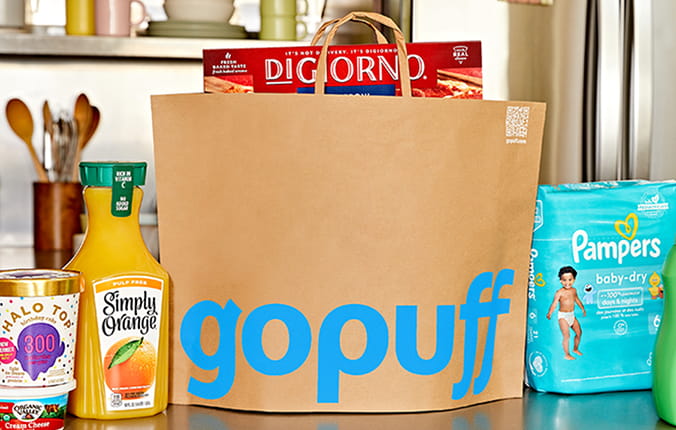 Gopuff delivery bag on kitchen counter with a selection of delivered grocery items