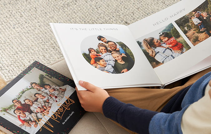 Person flipping through a customized Shutterfly memory book
