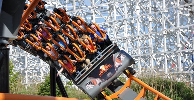 Riders on large rollercoaster