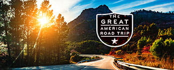 AAA Road Trip Resources menu image of winding road at sunset