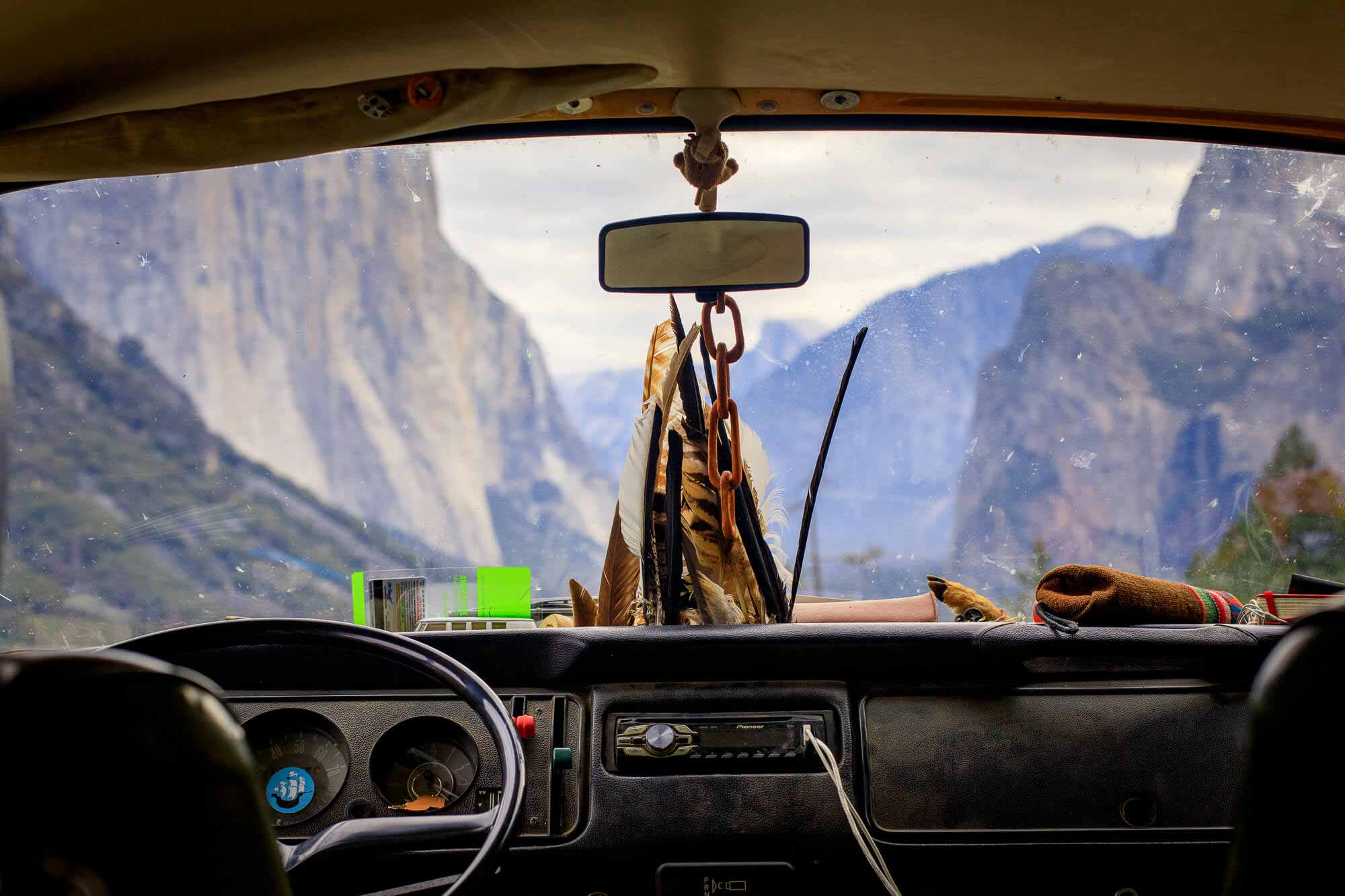View of Yosemite National Park through the windshield of a Volkswagen Bus