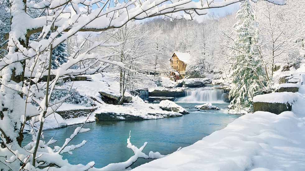 gristmill in snowy winter country 