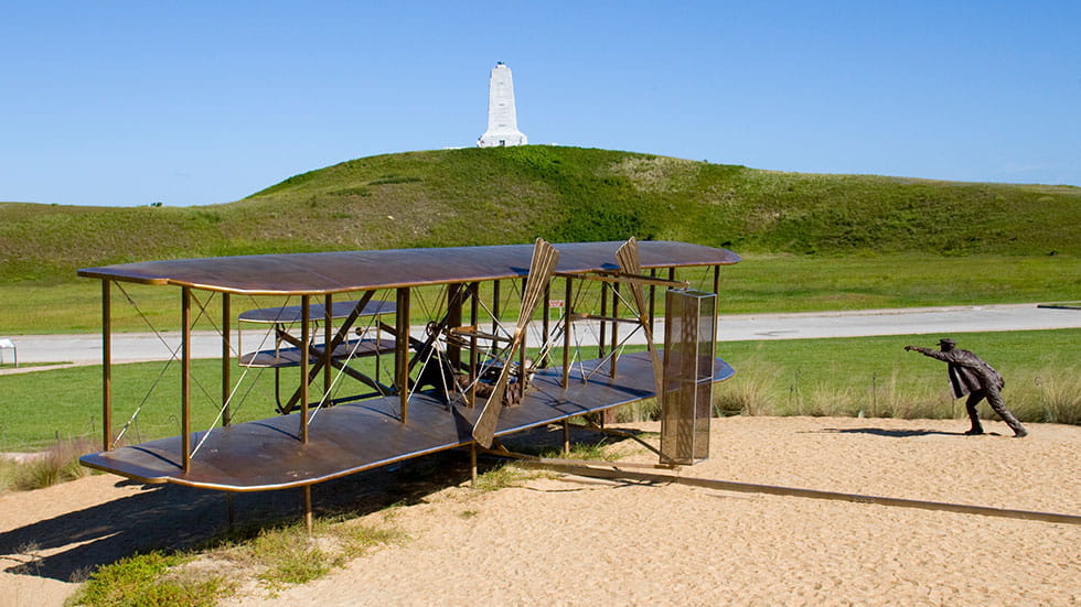 Visitors can soar over the giant sand dunes of Jockey's Ridge State Park in a replica 1902 Wright Glider, provided by a local outfitter, to enjoy a taste of what Orville and Wilbur must have felt at the dawn of flight on the OBX. Photo courtesy Outer Banks Tourism