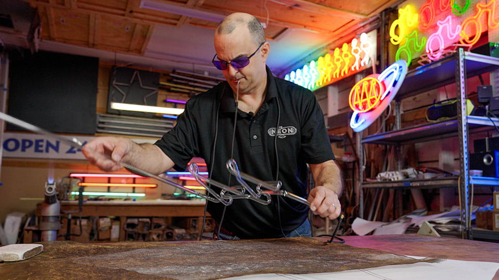Craig Weido at The Neon Company making a sign