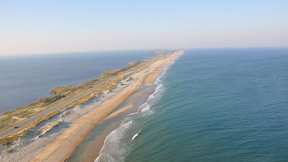 The islands of the Outer Banks are connected by two-lane coastal highway NC 12. Most of the Outer Banks is less than a mile wide but stretches for 130 miles north to south. Photo courtesy Outer Banks Tourism