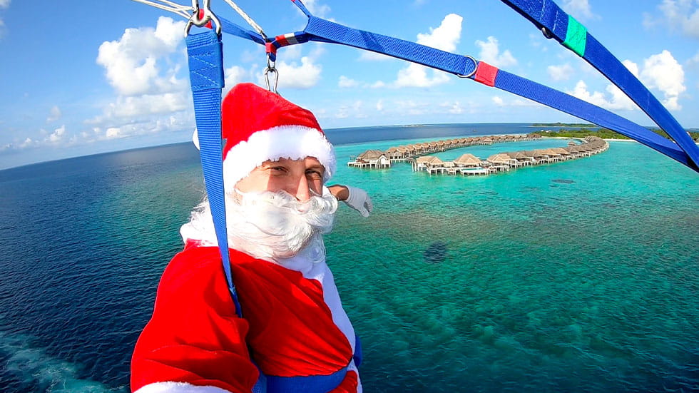 Santa paragliding in Maldives
