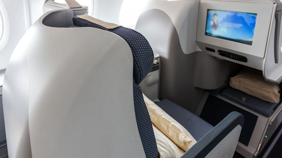 First class cabin in airplane.Photo courtesy of wonry/iStock.com
