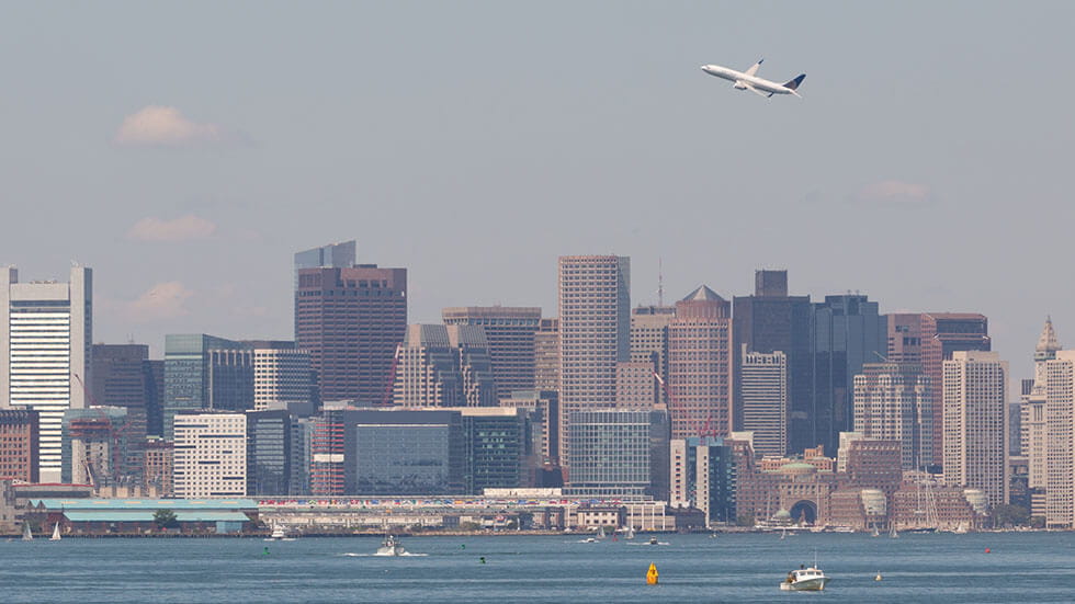 Plane flying over Boston