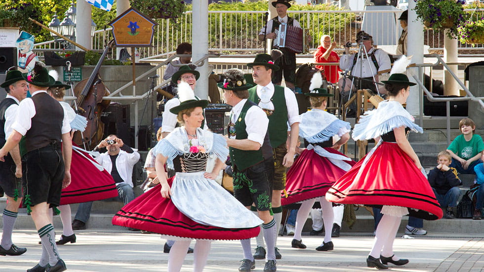 Local citizens performing dance wearing traditional bavarian attire. Photo courtesy of MayankYadav/iStock.com