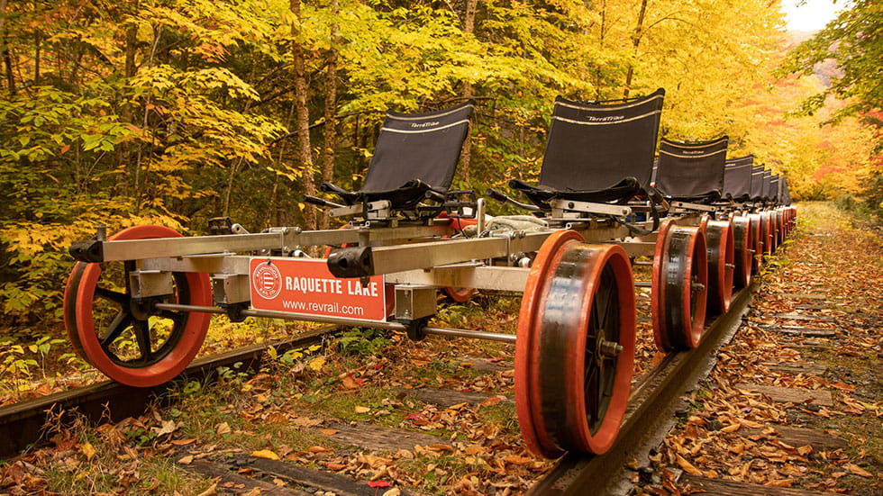 In fall, guests pedal on a four-person railbike on a tour with Revolution Rail Co. near Lake George, New York. Photo courtesy of Revolution Rail Co. 