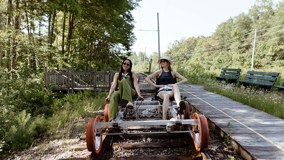 In summer, guests pedal a two-person railbike with Revolution Rail Co. in Kennebunkport, Maine. Photo courtesy of Revolution Rail Co. 
