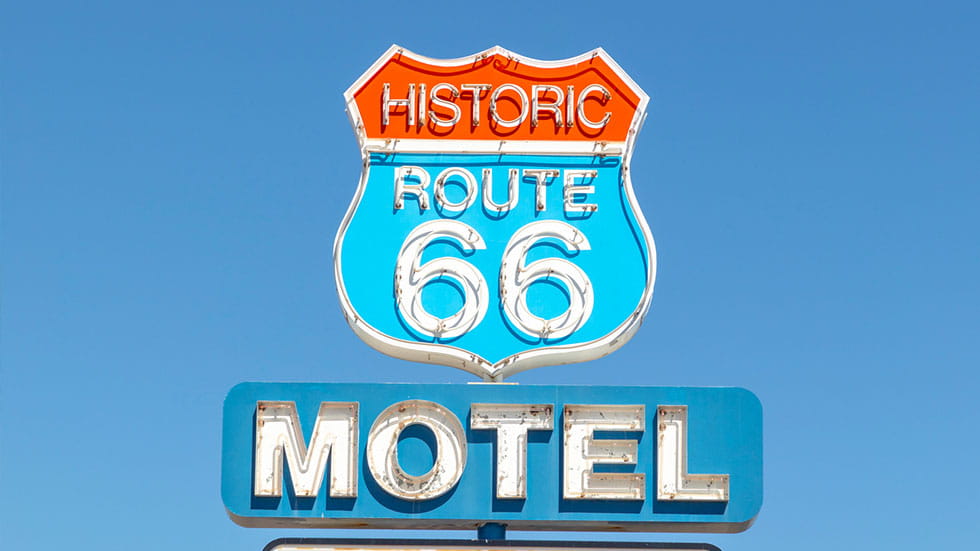 Motel and Route 66 sign on Historic Route 66. Built in 1904. Photo courtesy of Travelview/iStock.com
