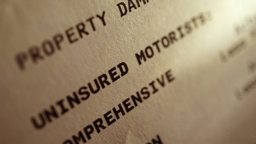 insurance document mentioning uninsured motorist, property damage, comprehensive